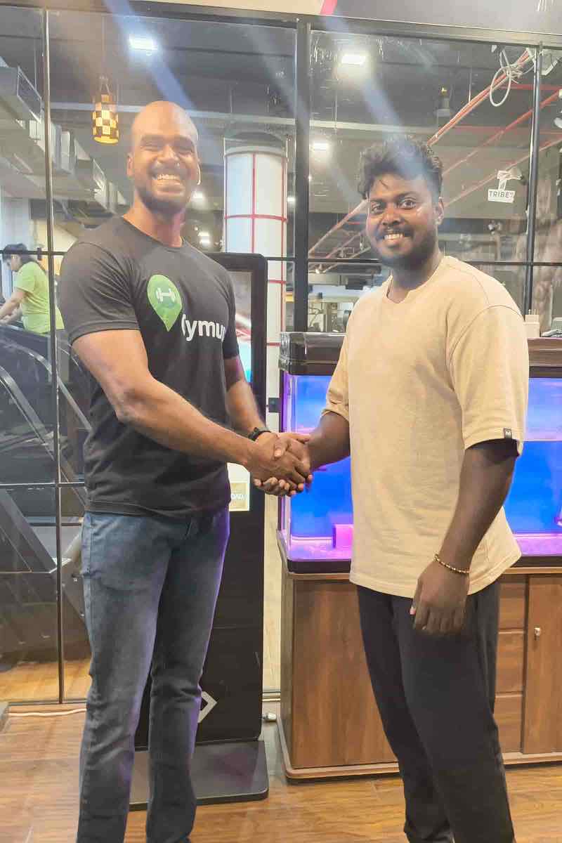 The Gymuu team with a member at Tribe 7