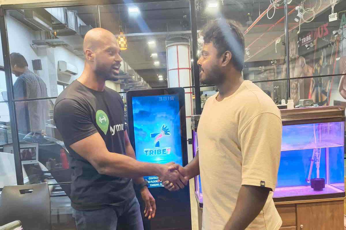 The Gymuu team shaking hands with the Tribe 7 gym team
